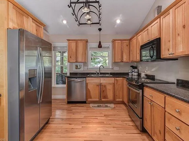 Cook's kitchen with brand new high-end refrigerator and 2-year old range.