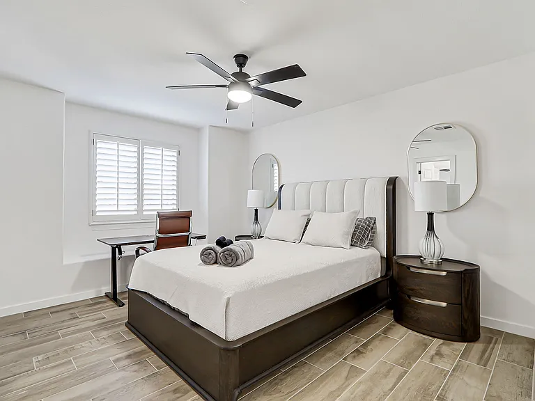Comfortable bedroom with queen bed and cozy work area!