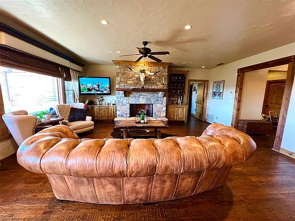 Beautiful Hand Scraped Hardwood Floors and Rock Fireplace.