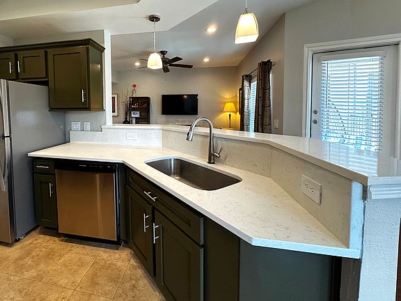 Kitchen features beautiful quartz counters