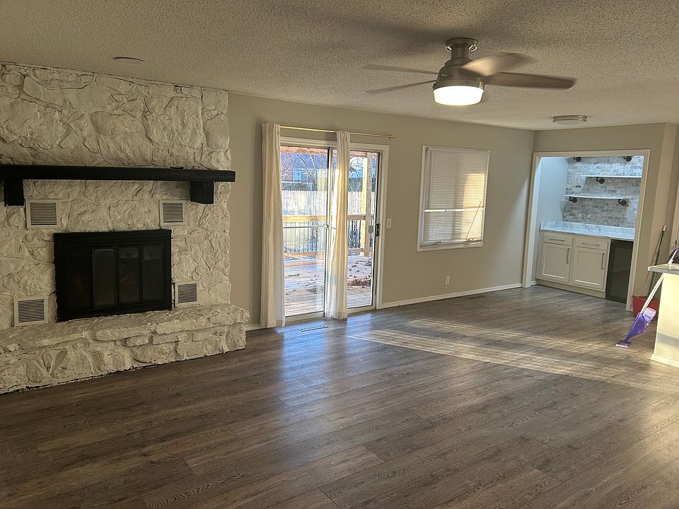 Open living room, bar access to covered deck and backyard