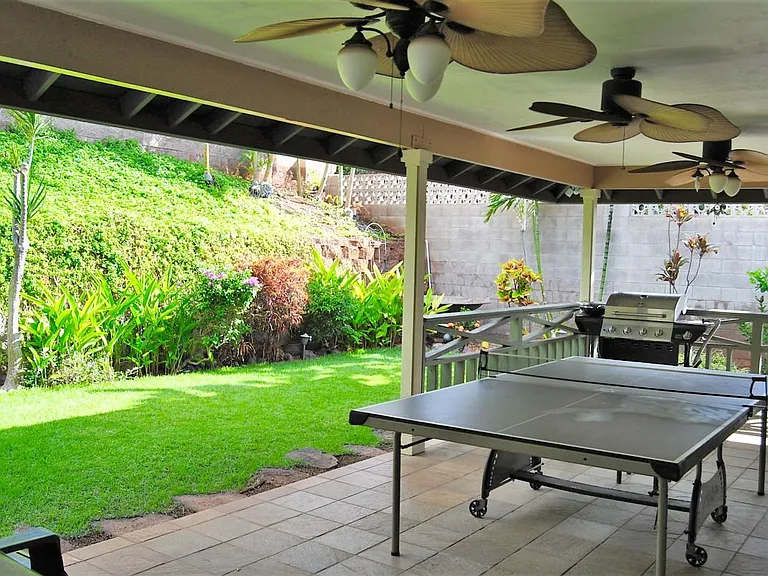 Lush landscaped yard, gardener included.
