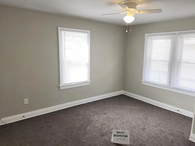 Back Bedroom 12'9" x 11'2", new ceiling fan, 3 windows with cordless blinds, carpet, 2 closets
