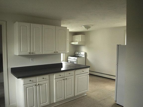 Large kitchen with plenty of cabinets.