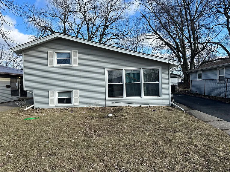 Beautiful, newly remodeled 4-bedroom, 1-bath home with hardwood floors, a side driveway, and a finished basement. Brok