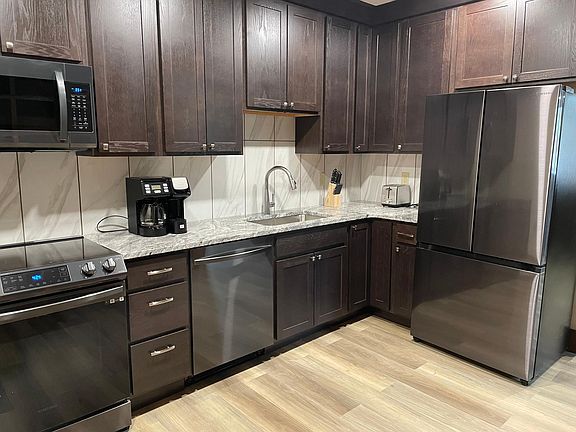 Beautiful new kitchen with granite counter tops and new appliances