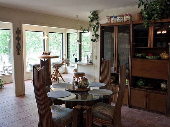 "Formal Dining Area with Tile Floors"