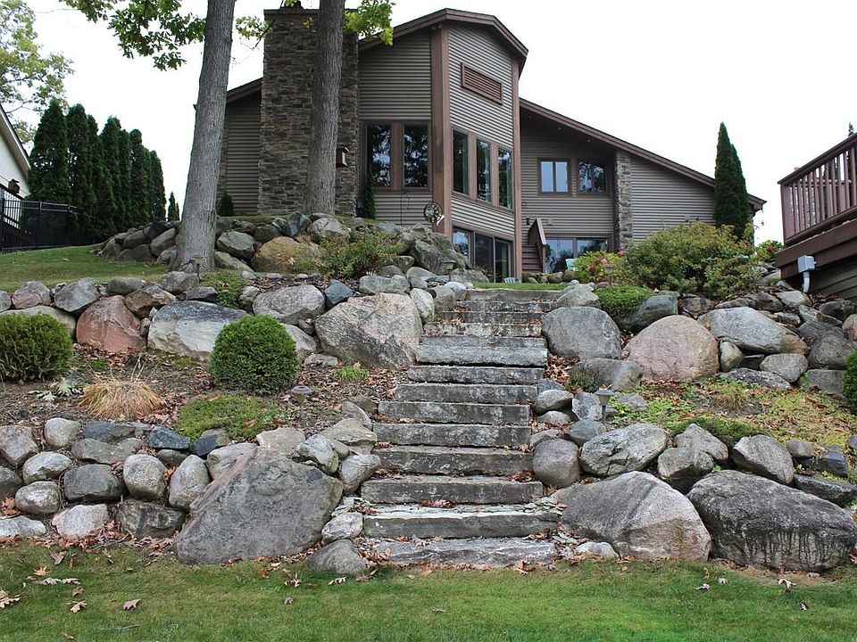 Welcome to 9435 Ridge Rd on Exclusive Lake Shinanguag!