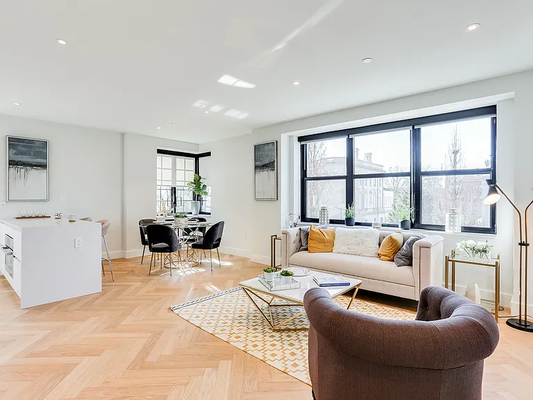 Open living and dining concept with lots of natural light, hardwood floors and Nest temperature control system.