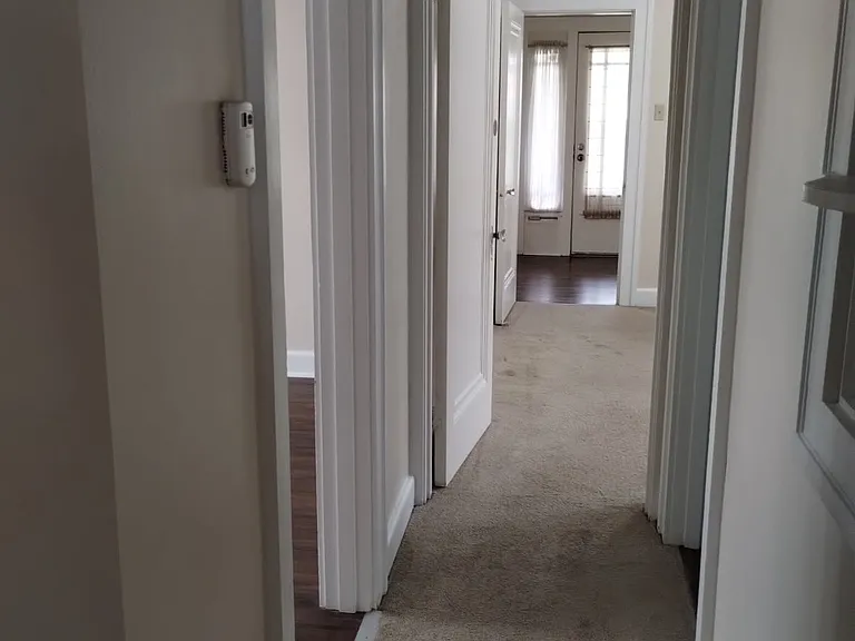 View from rear bedroom hallway to the entrance foyer