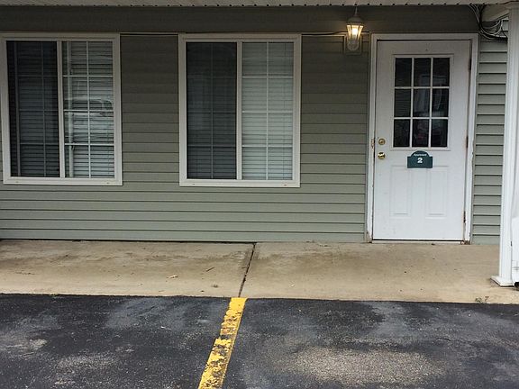 Entrance to apartment is behind the building. Covered porch 
