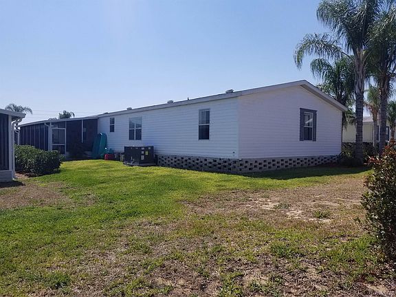 backyard with screened lanai