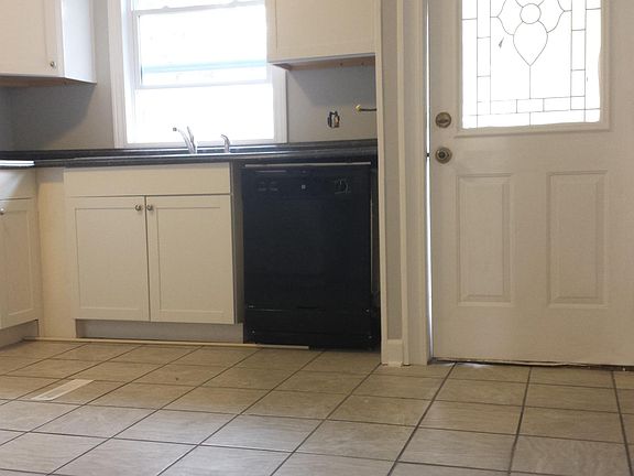 Kitchen with front door in view