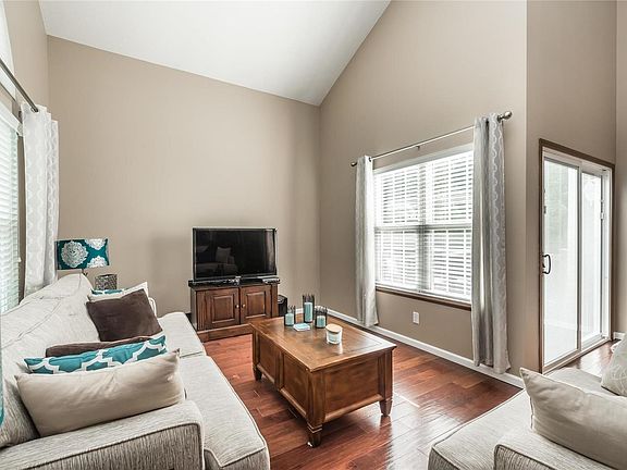 Light, bright family room with vaulted ceilings.