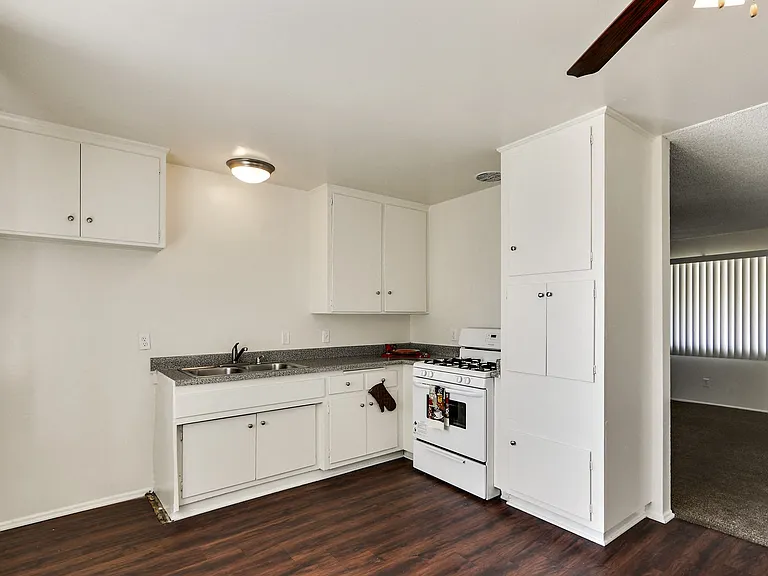 Kitchen with wood inspired floors throughout the dining area
