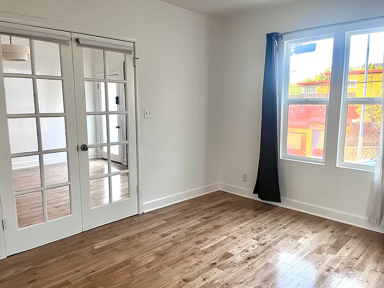 The front bedroom has French doors, a large closet and lots of natural light