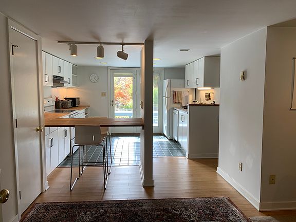 View from front door entrance looking through the kitchen to the garden.