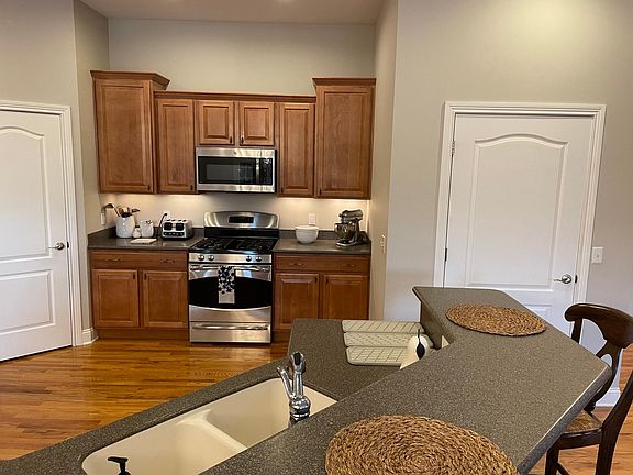 Stainless range, gas cooktop and microwave all included.