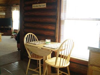 Dining area with a great view of the landscaped front yard.