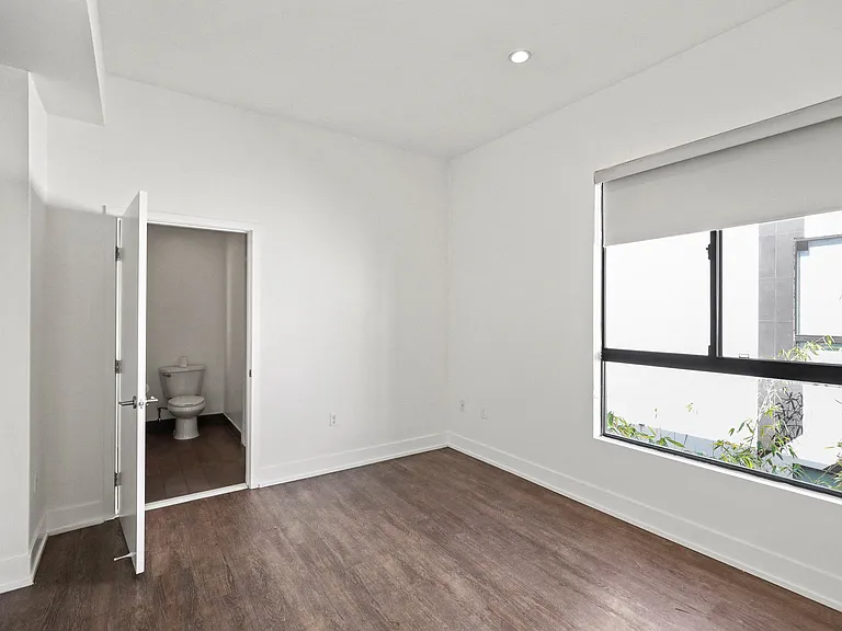 Bedroom with Large-Size Windows with Shades