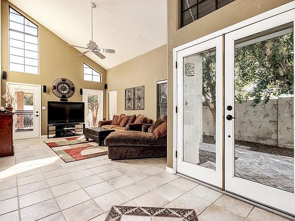 Vaulted ceilings, door to backyard, ceiling fans.