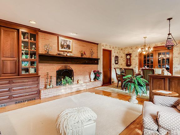 Handsome Pegged oak flooring extends into the dining area with french doors leading into the family room,  A great flow for entertaining.