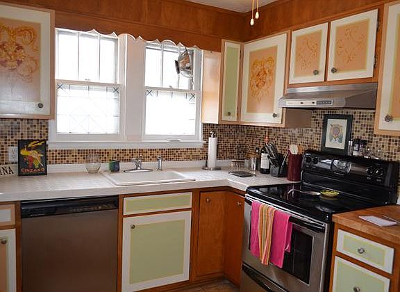 Kitchen w/wood cabinets and stainless appliances.