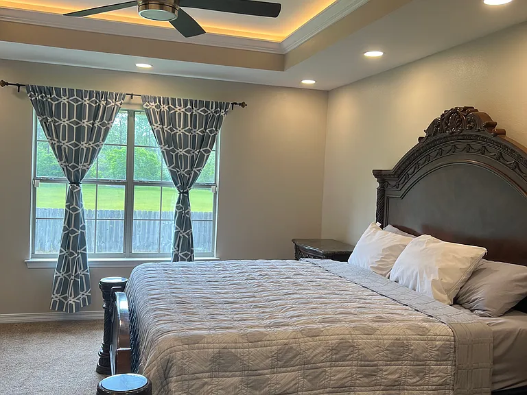 Owner Suite Bedroom with recess, lighting, as well as a coffered lighting in the Crawford ceiling