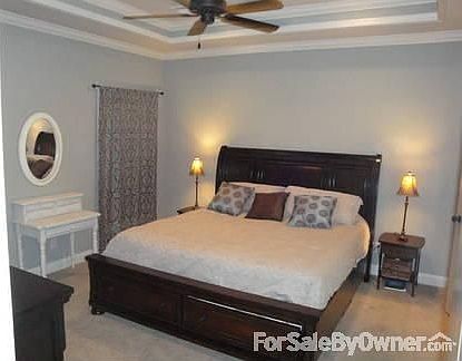Large master suite with trace ceilings : Walk-in closet with custom built-ins