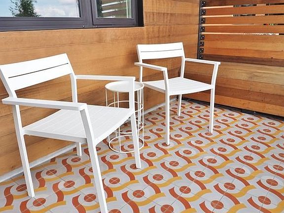 Watch the world go by from the comfort of your contemporary front porch.