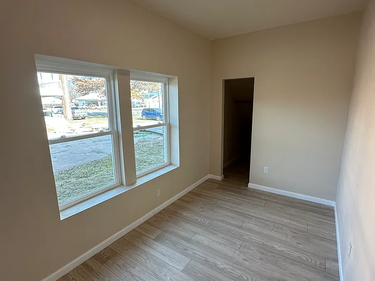 Bedroom approximately 8x12 plus a closet that goes all the way under the stairs. lots of storage space.