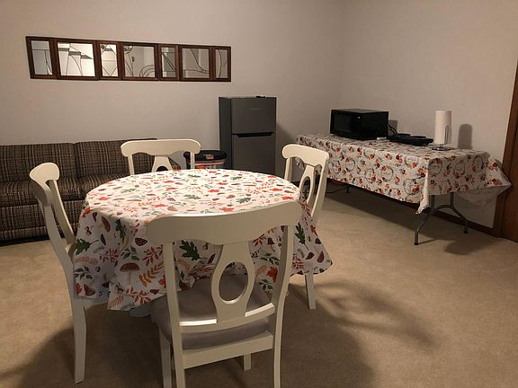 dining room table, fridge, microwave and 2 burnert pad. Couch folds out to a double bed