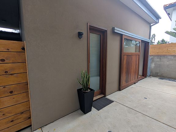 Front of unit, entry door closed, sliding door open