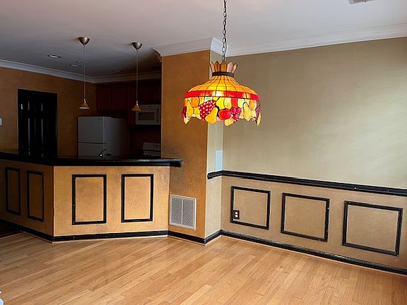 Dining room with kitchen in background.