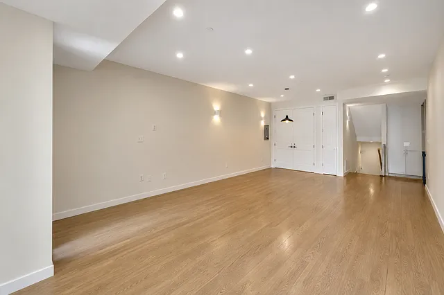 living room from front (Grove Street) side windows, large storage closet back left