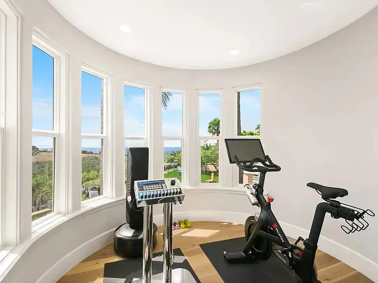 Start your morning off right in your master bedroom gym overlooking the expansive views!