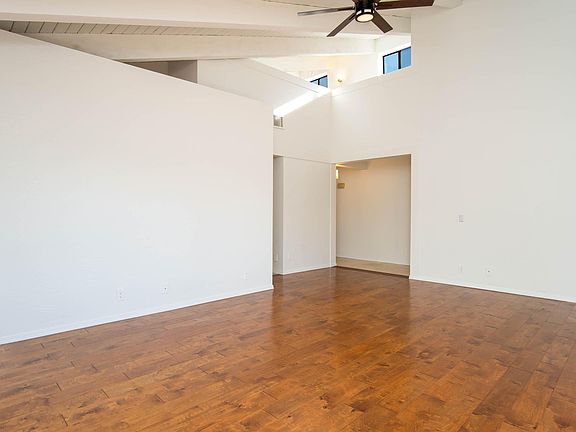 From the living room you can see the entry way and the loft at the top.