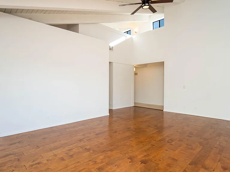 From the living room you can see the entry way and the loft at the top.