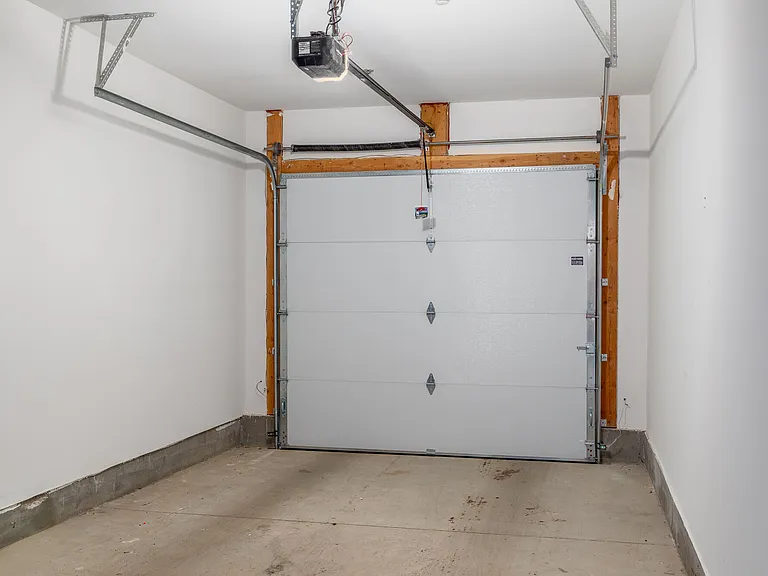 Semi-attached garage space with convenient building access available for rent.
