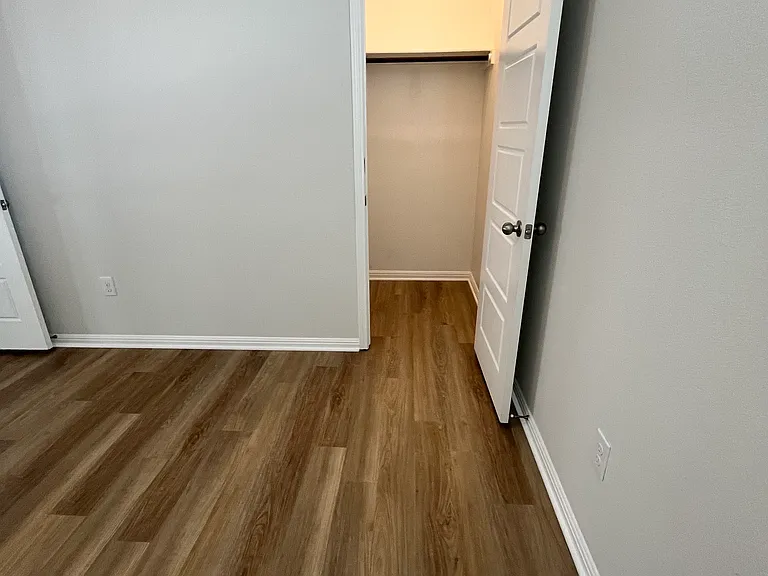 Each bedroom has a lighted, walk in closet