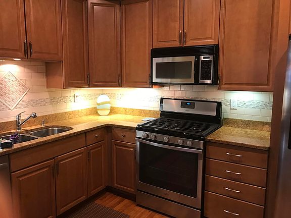 Kitchen with granite counter tops and new stainless steel ap