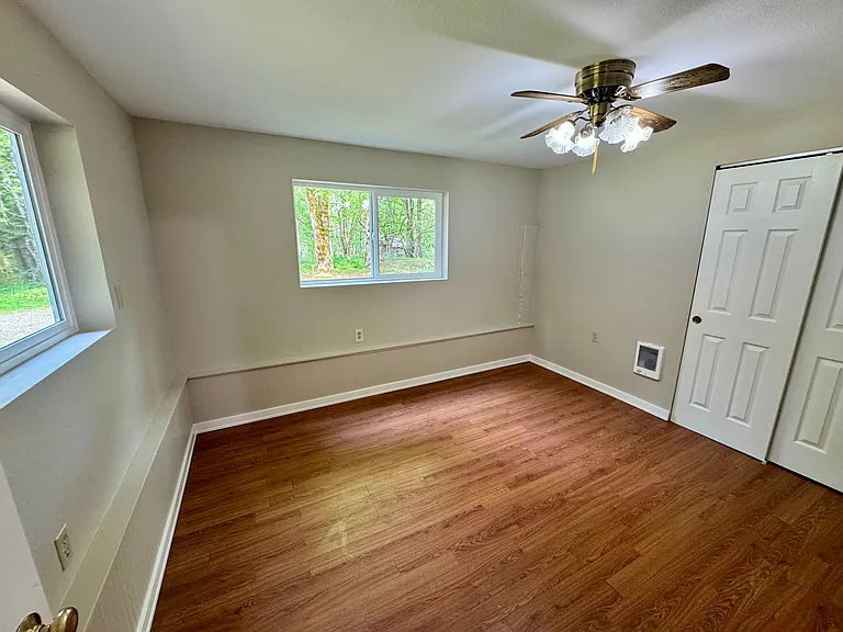Bedroom with New Vinyl windows and fresh paint.