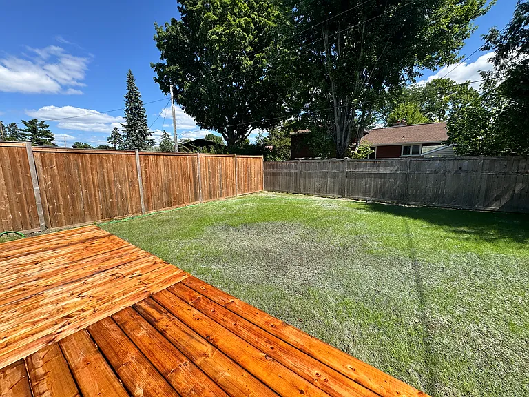 Private ground-level deck and outdoor seating area for our Ottawa guests.