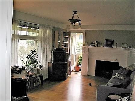 living room with fireplace and door to deck