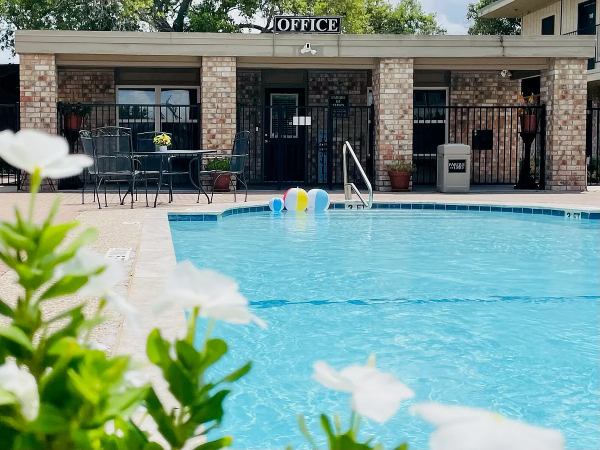 Our leasing office is located between building 6 and 7, where our friendly staff members await your arrival. - Parque De Oro Apartments