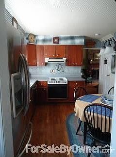 Family Room
						:
						Family room has a gas fireplace, hardwood floors, and a bay window.