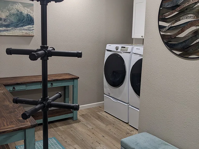 Laundry room located behind the breakfast area; large enough to function as a hobby room. (Shoe cabinets have been added, per reviewer's suggestion, because some do not want dirty shoes in closet with clean clothes). Laundry room leads to the garage.