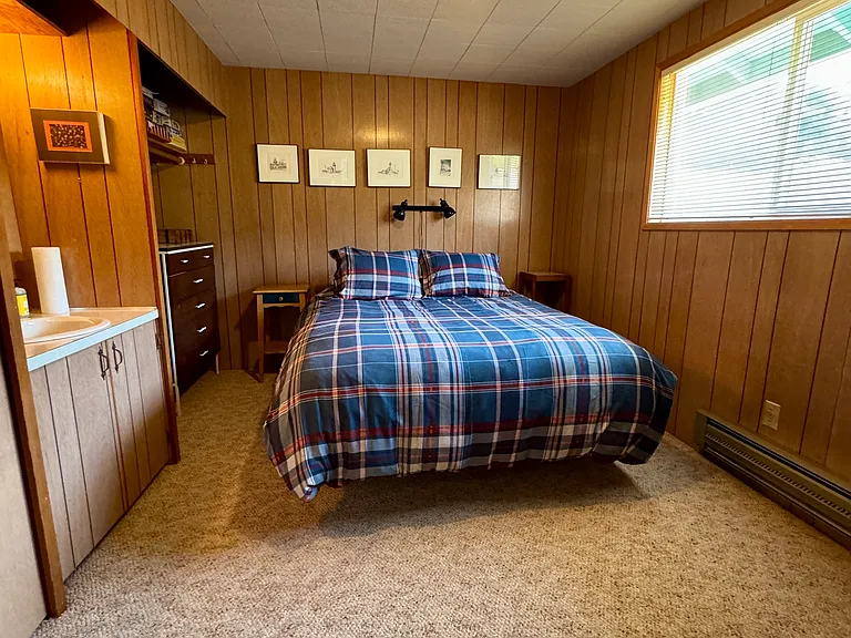 Primary bedroom upstairs with sink and daybed