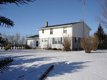 Here is a veiw of the back of the home with plenty of yard to expand or play.