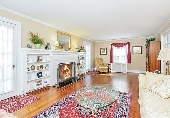 Living room with matching doors to private side yard